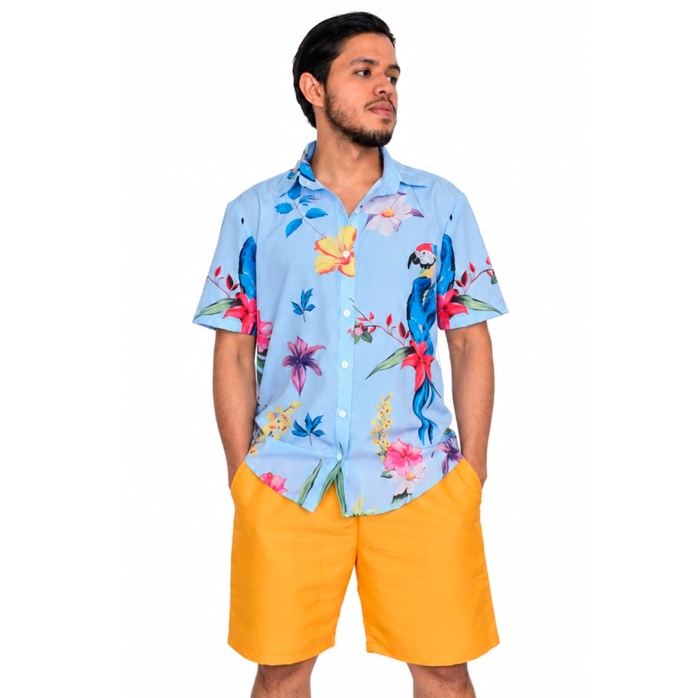 Modelo masculino vistiendo camisa manga corta celeste con estampado botánico y de aves de la categoría de ropa, calzado y accesorios de tumodacreativa.com
